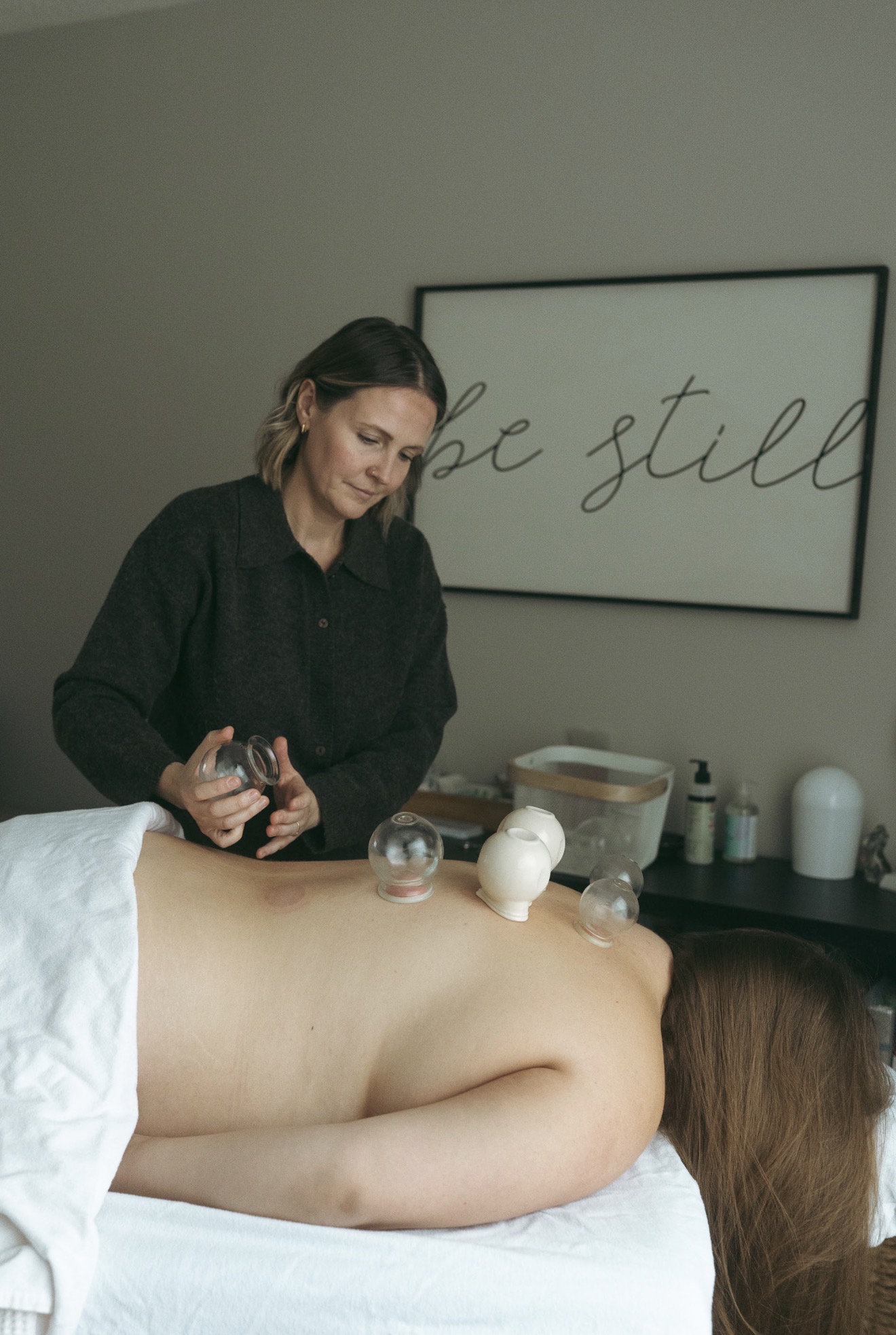 Jada providing cupping therapy